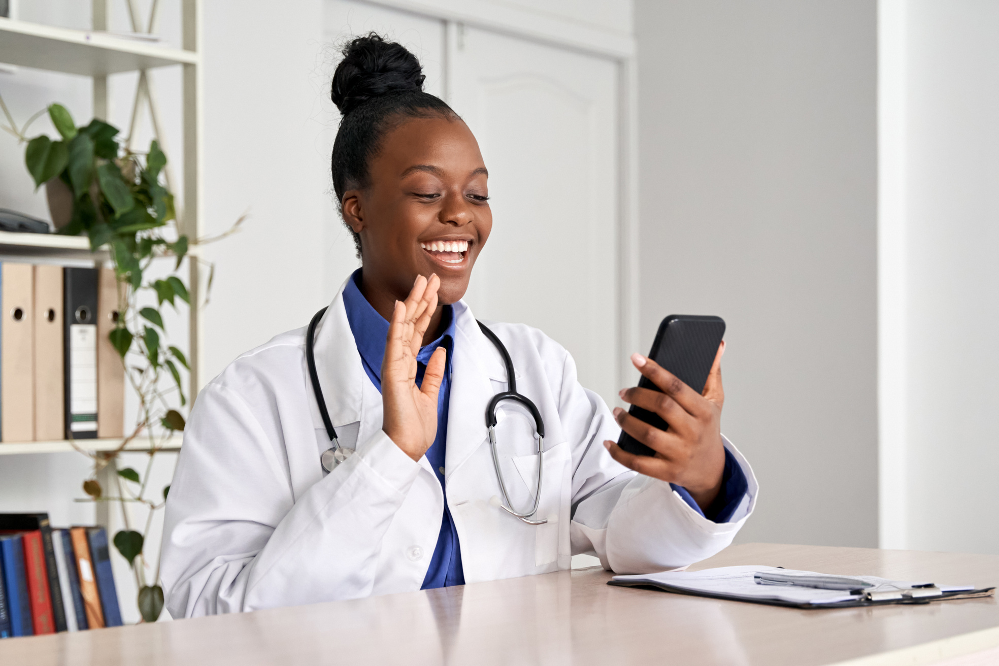 Doctor Video Calling Patient with Phone